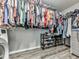The laundry room includes lots of clothing storage and plenty of shelving for shoes and detergent at 305 Nobleman Way, Canton, GA 30114