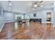 The living room features hardwood floors, an overhead fan, and a ping pong table at 305 Nobleman Way, Canton, GA 30114