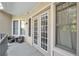 Spacious outdoor balcony with seating, view of windows and doors at 3621 Vinings Slope Se # 3204, Atlanta, GA 30339