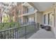 Outdoor balcony with wrought iron fencing and seating overlooking the property at 3621 Vinings Slope Se # 3204, Atlanta, GA 30339