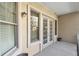 Inviting outdoor balcony with seating, view of windows and doors at 3621 Vinings Slope Se # 3204, Atlanta, GA 30339