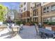 Outdoor courtyard featuring fountain, fireplace and patio seating at 3621 Vinings Slope Se # 3204, Atlanta, GA 30339