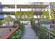 Brick-paved courtyard with manicured landscaping, seating, and a pond at 3621 Vinings Slope Se # 3204, Atlanta, GA 30339