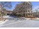 Charming condo complex with manicured greenery, inviting street view, and brick accents at 3621 Vinings Slope Se # 3204, Atlanta, GA 30339