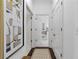 Bright hallway leads to the bathroom and has stylish art work adorning the walls at 3621 Vinings Slope Se # 3204, Atlanta, GA 30339