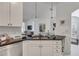 Gourmet kitchen with black granite countertops, stainless steel appliances, and view of the dining area at 3621 Vinings Slope Se # 3204, Atlanta, GA 30339