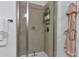 Walk-in tiled shower with glass door and modern fixtures at 3621 Vinings Slope Se # 3204, Atlanta, GA 30339