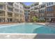 Lovely swimming pool surrounded by condos and landscaping, creating a serene atmosphere at 3621 Vinings Slope Se # 3204, Atlanta, GA 30339