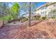 Spacious backyard with a fire pit, a patio, and landscaping, offering an ideal outdoor retreat at 3634 Lost Oak Dr, Buford, GA 30519