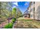 Spacious backyard with lush lawn, mature trees and privacy fence at 3634 Lost Oak Dr, Buford, GA 30519
