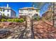Backyard with fire pit, lush landscaping, and convenient steps leading up to the back of the house at 3634 Lost Oak Dr, Buford, GA 30519