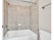 Bathroom features white tiled shower with updated fixtures at 3634 Lost Oak Dr, Buford, GA 30519