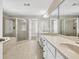 Large primary bathroom featuring dual sinks, glass enclosed shower and soaking tub at 3634 Lost Oak Dr, Buford, GA 30519