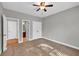 Bedroom with neutral walls, ceiling fan, and plush carpeting at 3634 Lost Oak Dr, Buford, GA 30519