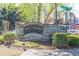 Stone community entrance sign for Bogan's Bridge Crossing welcomes residents and guests at 3634 Lost Oak Dr, Buford, GA 30519