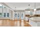 Bright eat-in kitchen features white cabinets, stainless steel appliances, and an abundance of natural light at 3634 Lost Oak Dr, Buford, GA 30519