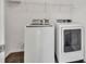 Bright laundry room featuring modern, front-load washing machine and dryer at 3634 Lost Oak Dr, Buford, GA 30519