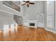 Spacious living room with hardwood floors, fireplace, and built-in shelving exudes warmth and elegance at 3634 Lost Oak Dr, Buford, GA 30519