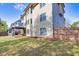 Spacious backyard with healthy green lawn, privacy fence and a second story deck at 3634 Lost Oak Drive, Buford, GA 30519
