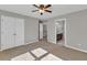 Bedroom with a view into an adjacent bathroom and hallway, closet, and neutral walls at 3634 Lost Oak Drive, Buford, GA 30519