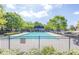 Community pool and clubhouse with lounge chairs and a gated entrance, perfect for relaxation at 3634 Lost Oak Drive, Buford, GA 30519