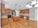 Inviting kitchen features a central island, stainless steel appliances, and plenty of counter space at 3634 Lost Oak Drive, Buford, GA 30519