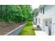 View of a well maintained lawn and wooded area behind the townhomes at 4277 Arcadia Dr, Decatur, GA 30034