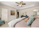 Bright bedroom with plush carpet, neutral walls, and tray ceiling leading to a walk in closet and bath at 4277 Arcadia Dr, Decatur, GA 30034