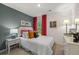 Bedroom with an accent wall, plush carpet, and a large window to let in natural lighting at 4277 Arcadia Dr, Decatur, GA 30034