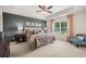 Primary bedroom with a decorative accent wall, tray ceiling, carpet flooring, and lots of natural light at 4277 Arcadia Dr, Decatur, GA 30034