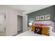 Well-lit bedroom with carpet flooring and an open closet nearby at 4277 Arcadia Dr, Decatur, GA 30034