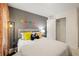 This bedroom features a cozy bed with a striped comforter, and colorful Pacman themed wall decor at 4277 Arcadia Dr, Decatur, GA 30034