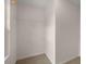 Walk-in closet, ready for customization, has neutral paint and carpeted floor at 4277 Arcadia Dr, Decatur, GA 30034
