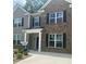 Charming townhouse with brick and siding exterior, offering a welcoming entrance and modern appeal at 4277 Arcadia Dr, Decatur, GA 30034