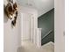 Bright hallway with carpet flooring and a view of the decorative stairwell at 4277 Arcadia Dr, Decatur, GA 30034