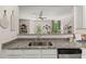 The kitchen features granite countertops, stainless appliances, and an open view to the adjacent living room at 4277 Arcadia Dr, Decatur, GA 30034