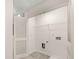Functional laundry room with ample storage, laundry tub, and flooring at 4277 Arcadia Dr, Decatur, GA 30034