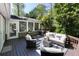 Relaxing outdoor living space with comfortable seating, grilling area, and lush greenery at 540 Cambridge Way, Atlanta, GA 30328