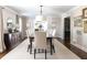 Spacious dining room boasting neutral decor, large windows, and ample seating for formal gatherings at 540 Cambridge Way, Atlanta, GA 30328