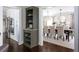 Elegant dining room featuring built-in shelving, a dining table and access to the kitchen at 540 Cambridge Way, Atlanta, GA 30328