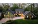 Charming two-story home with a well-manicured lawn and professionally landscaped yard at 540 Cambridge Way, Atlanta, GA 30328