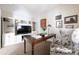 Well-lit home office with a desk, shelving, and a comfortable chair, perfect for remote work at 540 Cambridge Way, Atlanta, GA 30328