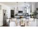 Well-lit kitchen featuring stainless steel appliances, white cabinets, and a breakfast bar with seating at 540 Cambridge Way, Atlanta, GA 30328