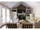 Inviting living room boasts stone fireplace, built-in bookshelves, vaulted ceilings and French doors at 540 Cambridge Way, Atlanta, GA 30328