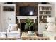Stylish living room with a stone fireplace, built-in shelving, and comfortable seating at 540 Cambridge Way, Atlanta, GA 30328