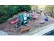 Community playground equipment featuring slides, climbing apparatus, and benches at 540 Cambridge Way, Atlanta, GA 30328