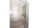 Close-up of the glass shower with built-in bench and tiled surround at 540 Cambridge Way, Atlanta, GA 30328