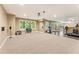 Spacious basement with neutral carpeting and tile, windows, bar, and space for activities at 150 Fitzroy Ln, Acworth, GA 30101