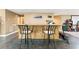 Basement bar area with tile flooring and seating for two at 150 Fitzroy Ln, Acworth, GA 30101