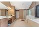 Bathroom with double vanity, glass-enclosed shower, and separate soaking tub at 150 Fitzroy Ln, Acworth, GA 30101